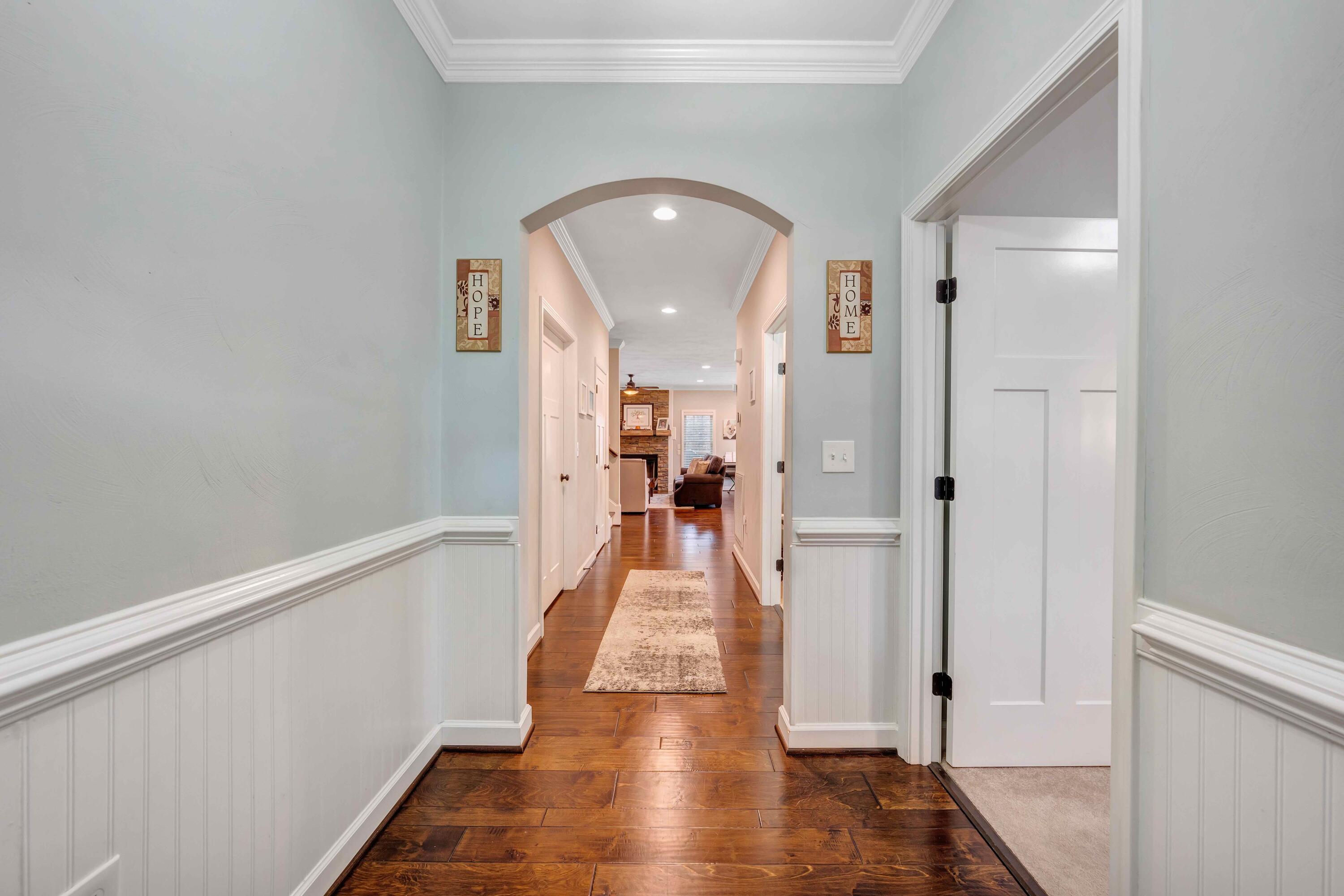 7041 Mountain Spring Trail Roanoke, VA 24018 - Photo 10 of 62 a view of a hallway view with wooden floor and staircase
