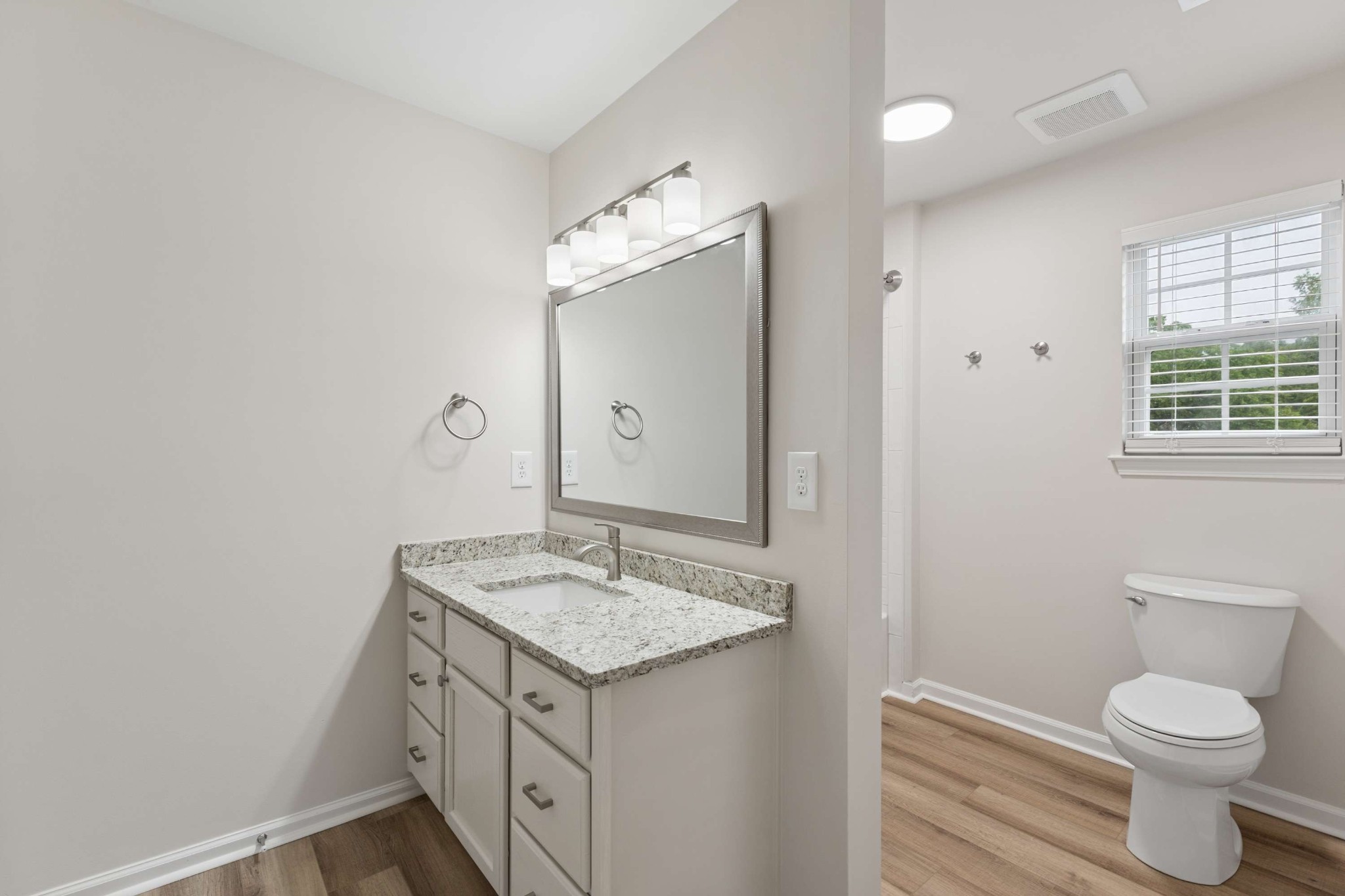 7100 Wheat Road Fairview, TN 37062 - Photo 18 of 25 a bathroom with a granite countertop sink toilet and shower