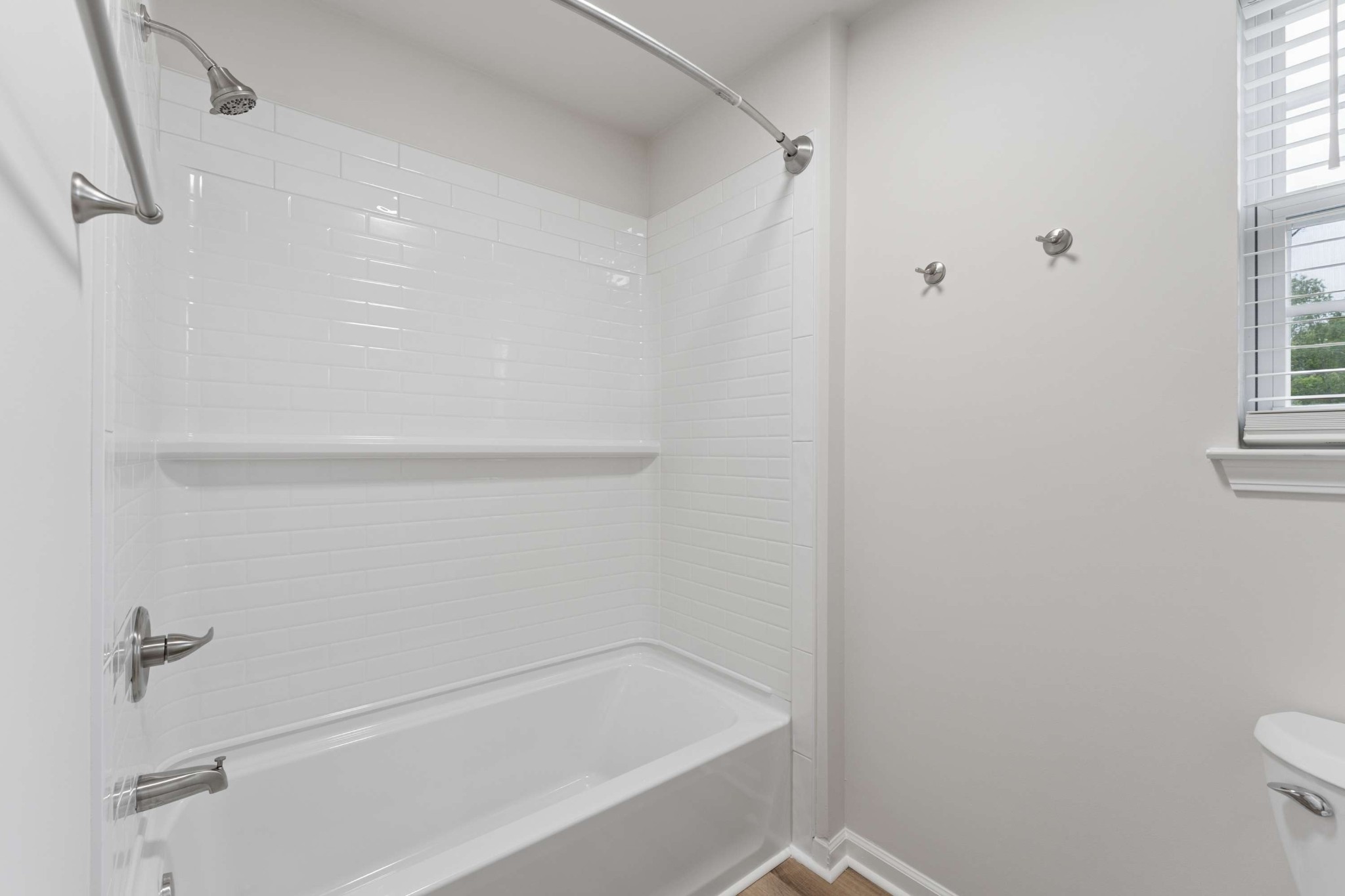 7100 Wheat Road Fairview, TN 37062 - Photo 19 of 25 a bathroom with a bathtub and a toilet