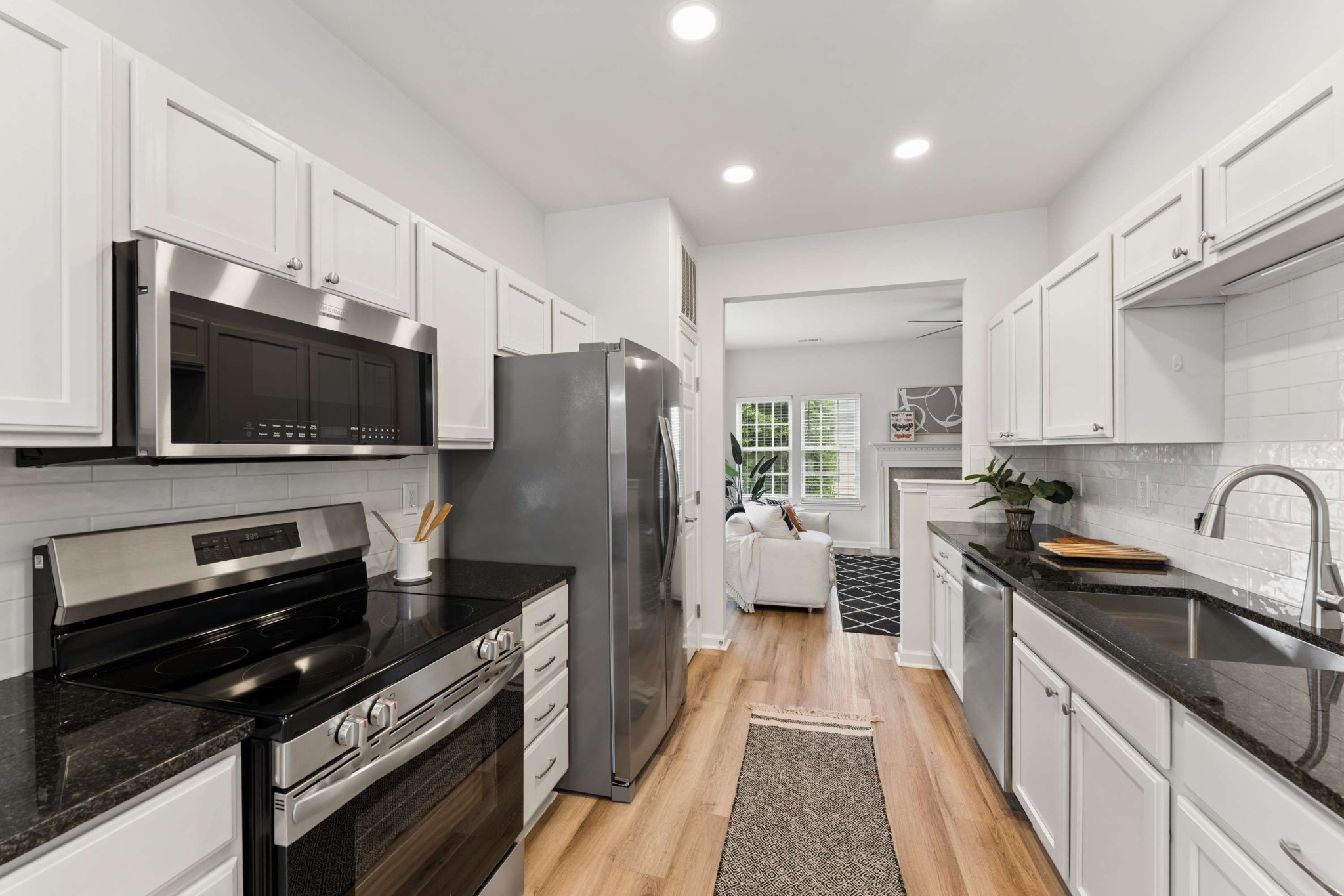 7100 Wheat Road Fairview, TN 37062 - Photo 8 of 25 a kitchen with stainless steel appliances a stove a sink and a refrigerator