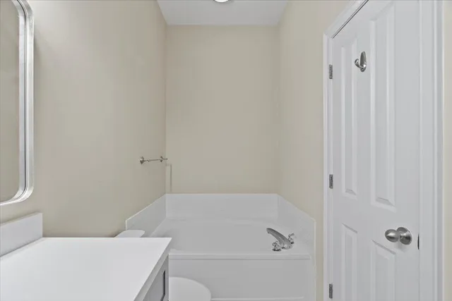a bathroom with a bathtub and shower