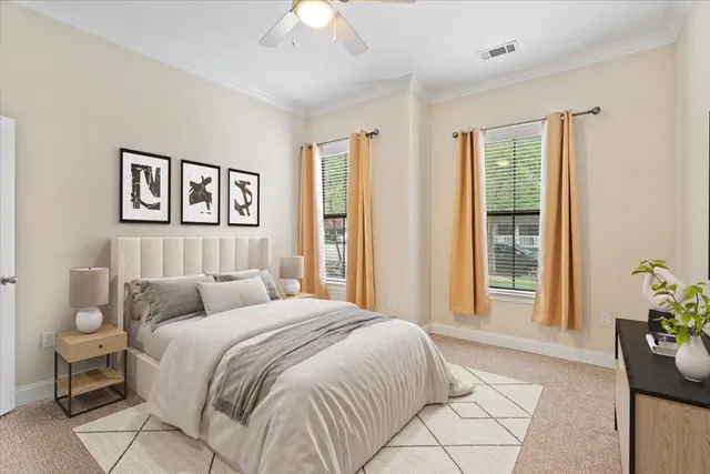 a spacious bedroom with a bed and a window