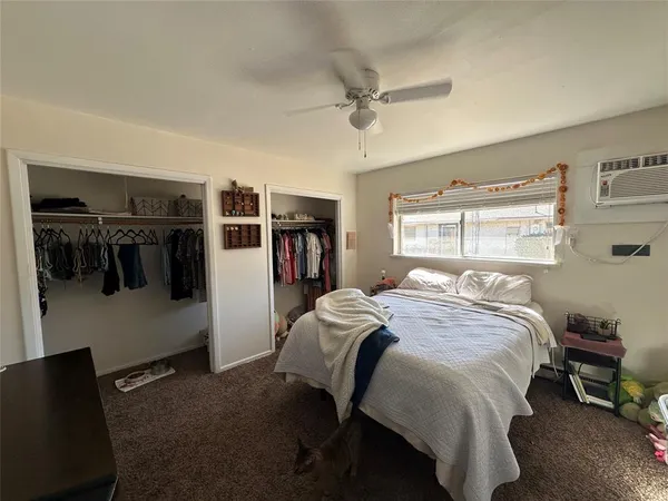 a bedroom with a bed and a walk in closet