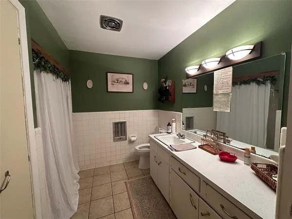 a bathroom with a sink a mirror and a shower