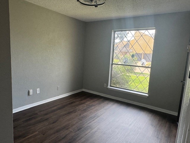 10106 Prairie Mist Street Houston, TX 77088 - Photo 14 of 20 an empty room with wooden floor and windows