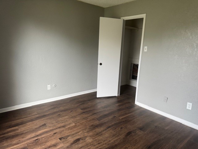 10106 Prairie Mist Street Houston, TX 77088 - Photo 15 of 20 a view of an empty room with wooden floor and closet