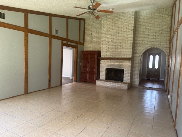 10106 Prairie Mist Street Houston, TX 77088 - Photo 3 of 20 a view of a livingroom with an empty space and a fireplace