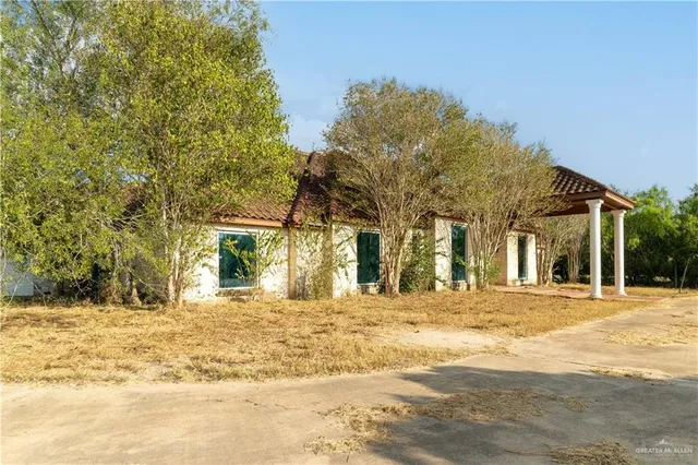 a house with trees in the background