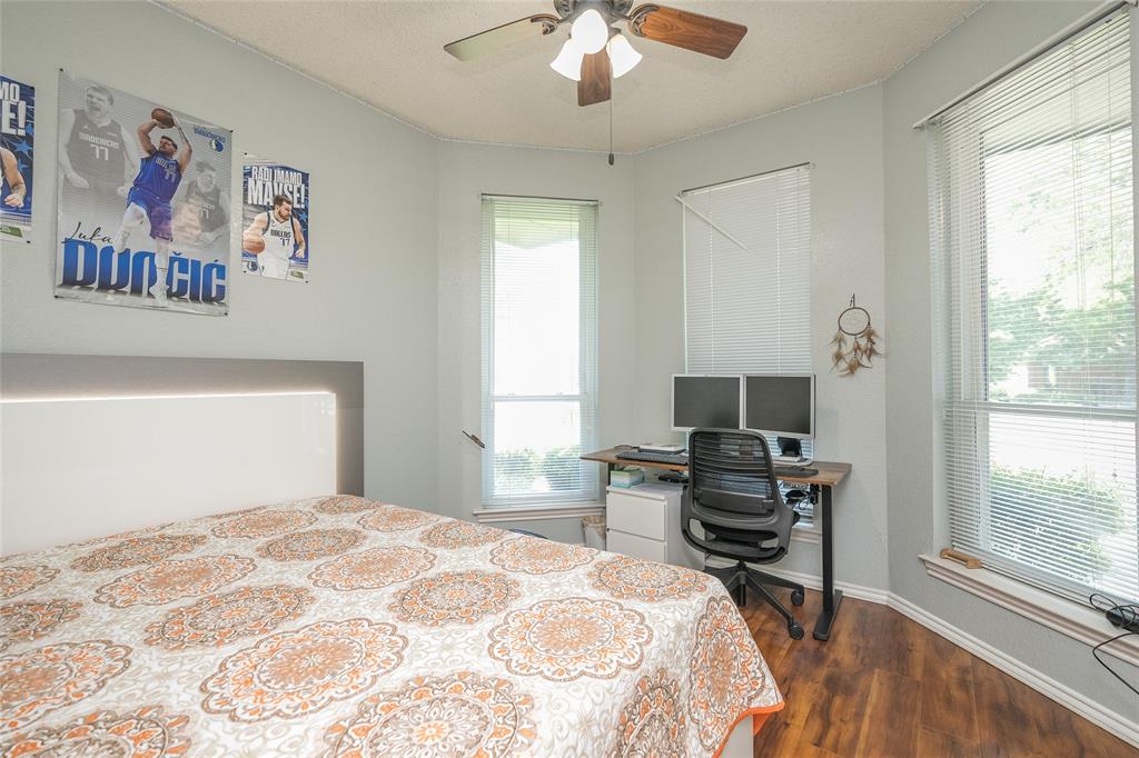 116 Meadowglen Circle Coppell, TX 75019 - Photo 16 of 32 a bedroom with a bed and a window