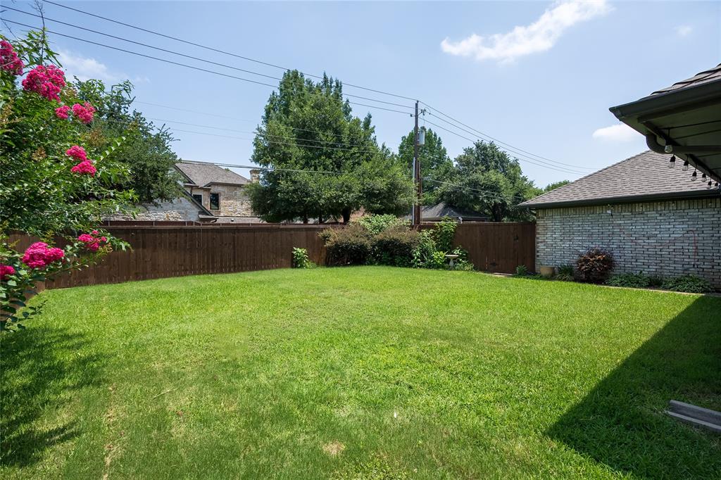 116 Meadowglen Circle Coppell, TX 75019 - Photo 27 of 32 a backyard of a house with lots of green space