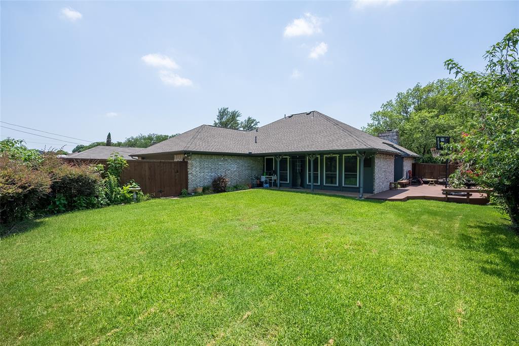 116 Meadowglen Circle Coppell, TX 75019 - Photo 28 of 32 a front view of a house with a garden and yard