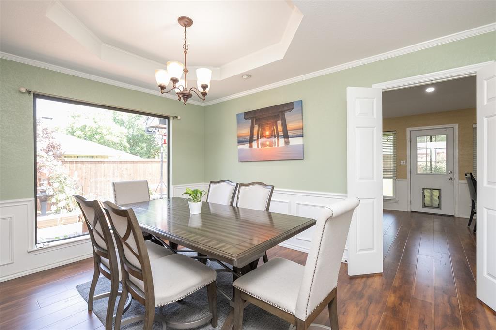 116 Meadowglen Circle Coppell, TX 75019 - Photo 5 of 32 a view of a dining room with furniture window and wooden floor