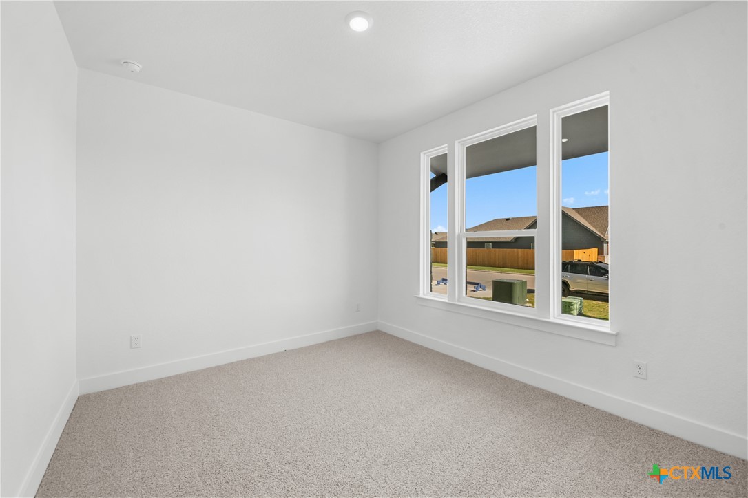 8917 Ponderosa Pine Road Temple, TX 76502 - Photo 10 of 16 a view of an empty room with a window
