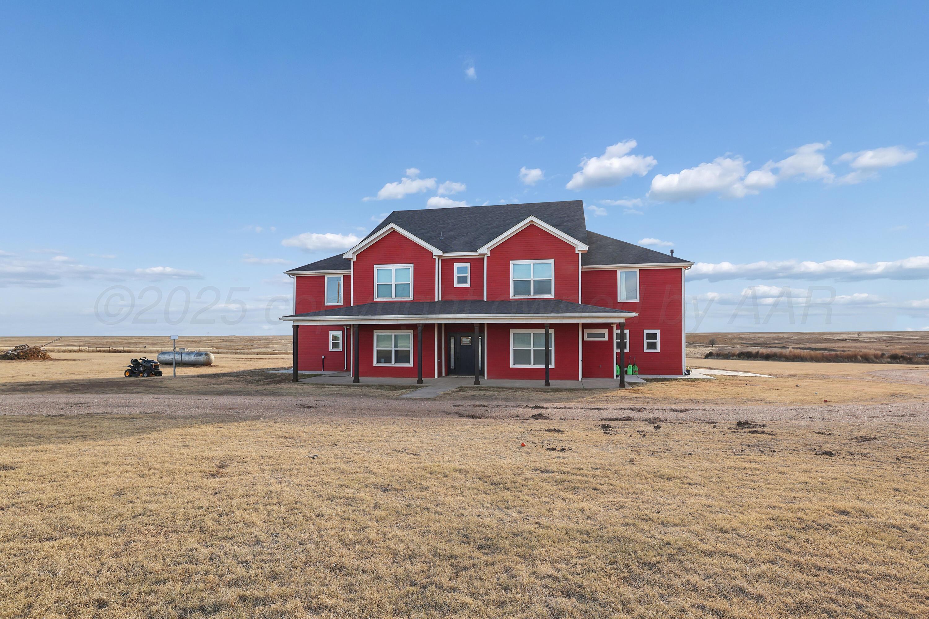 5282 County Road 8 Claude, TX 79019 - Photo 2 of 51 a front view of a house with a ocean view