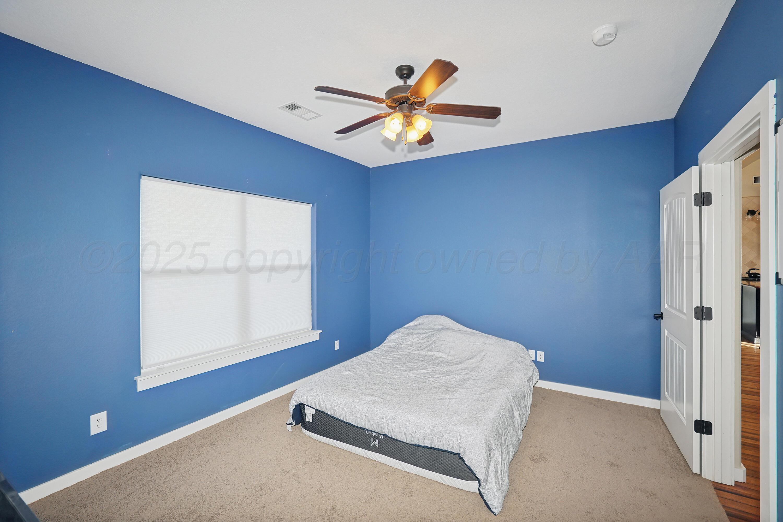 5282 County Road 8 Claude, TX 79019 - Photo 23 of 51 a view of a livingroom with a ceiling fan and window