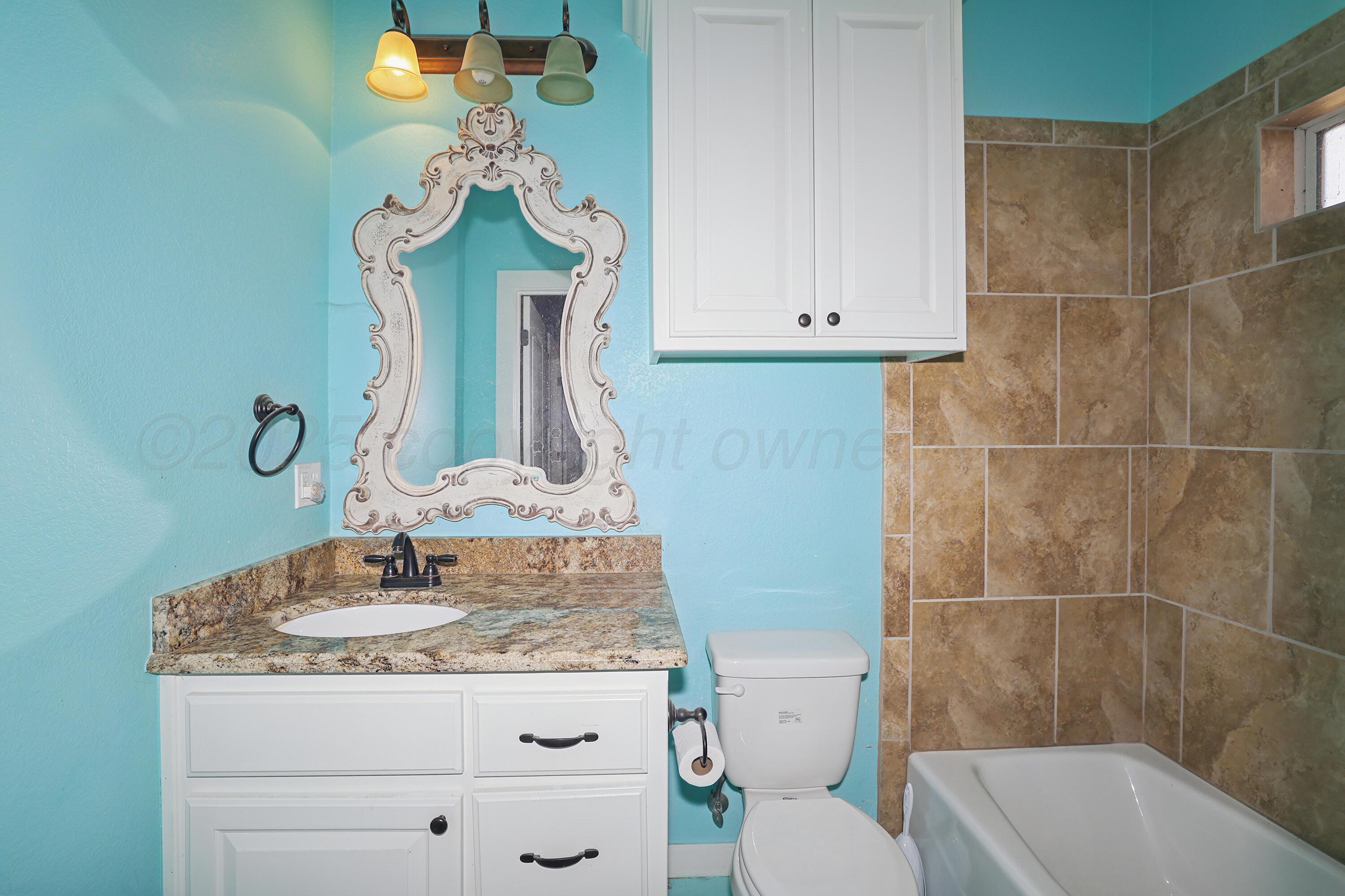 5282 County Road 8 Claude, TX 79019 - Photo 25 of 51 a bathroom with a sink a toilet and shower
