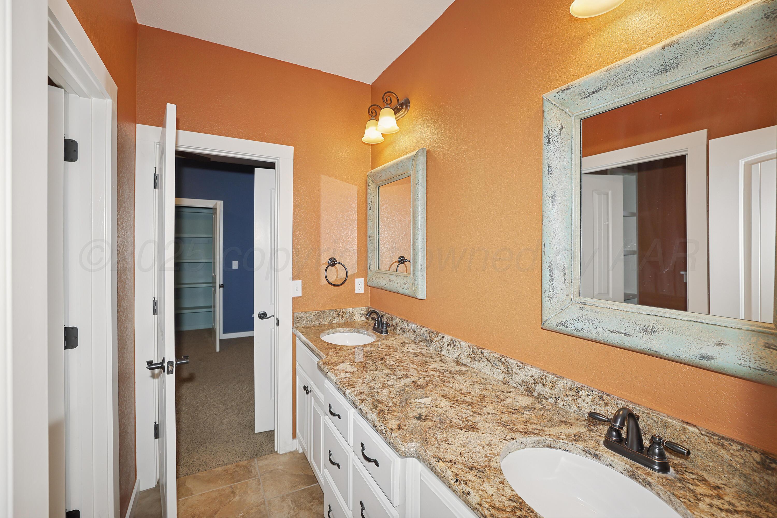 5282 County Road 8 Claude, TX 79019 - Photo 34 of 51 a bathroom with a granite countertop double vanity sink mirror and
