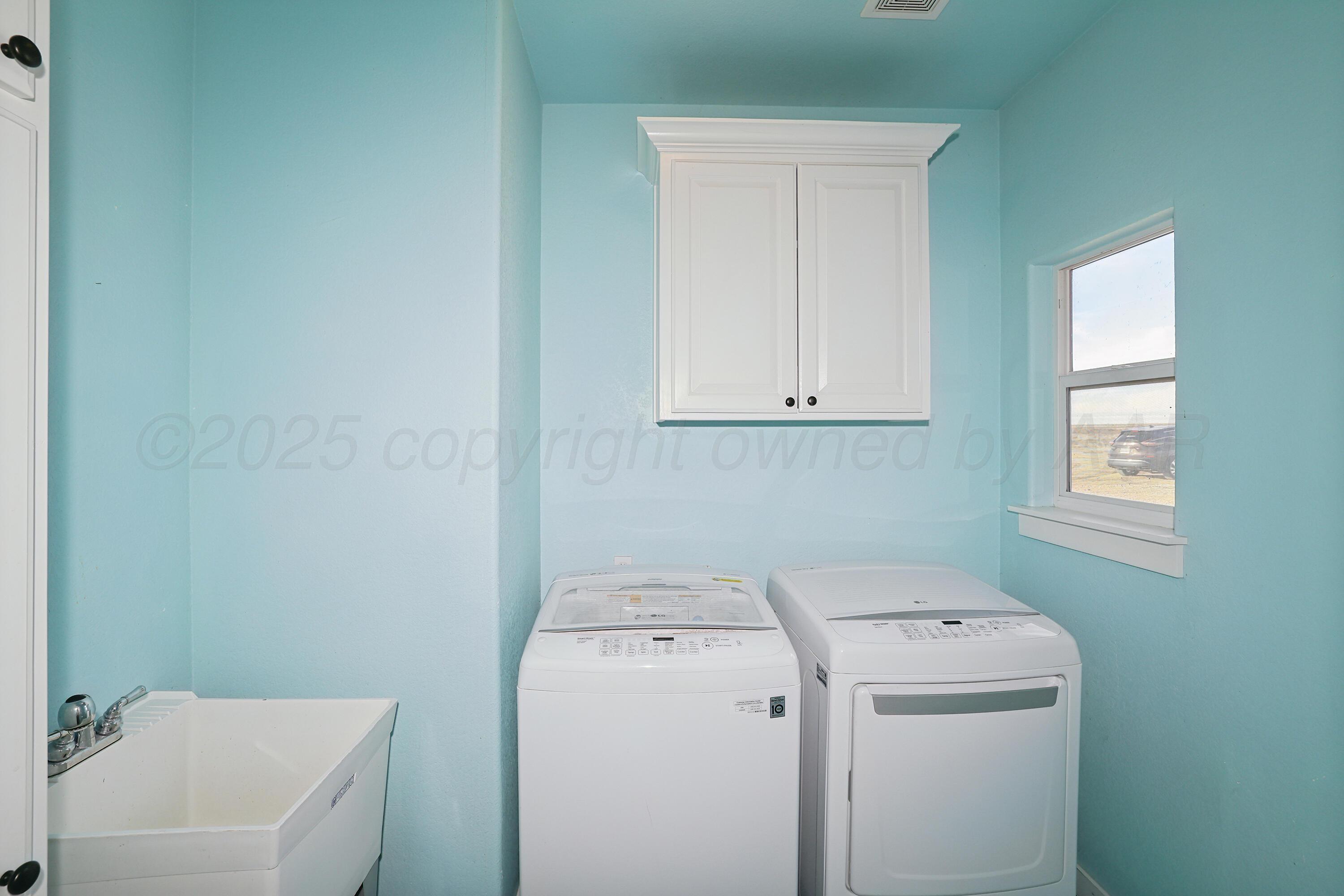5282 County Road 8 Claude, TX 79019 - Photo 42 of 51 a utility room with dryer and washer