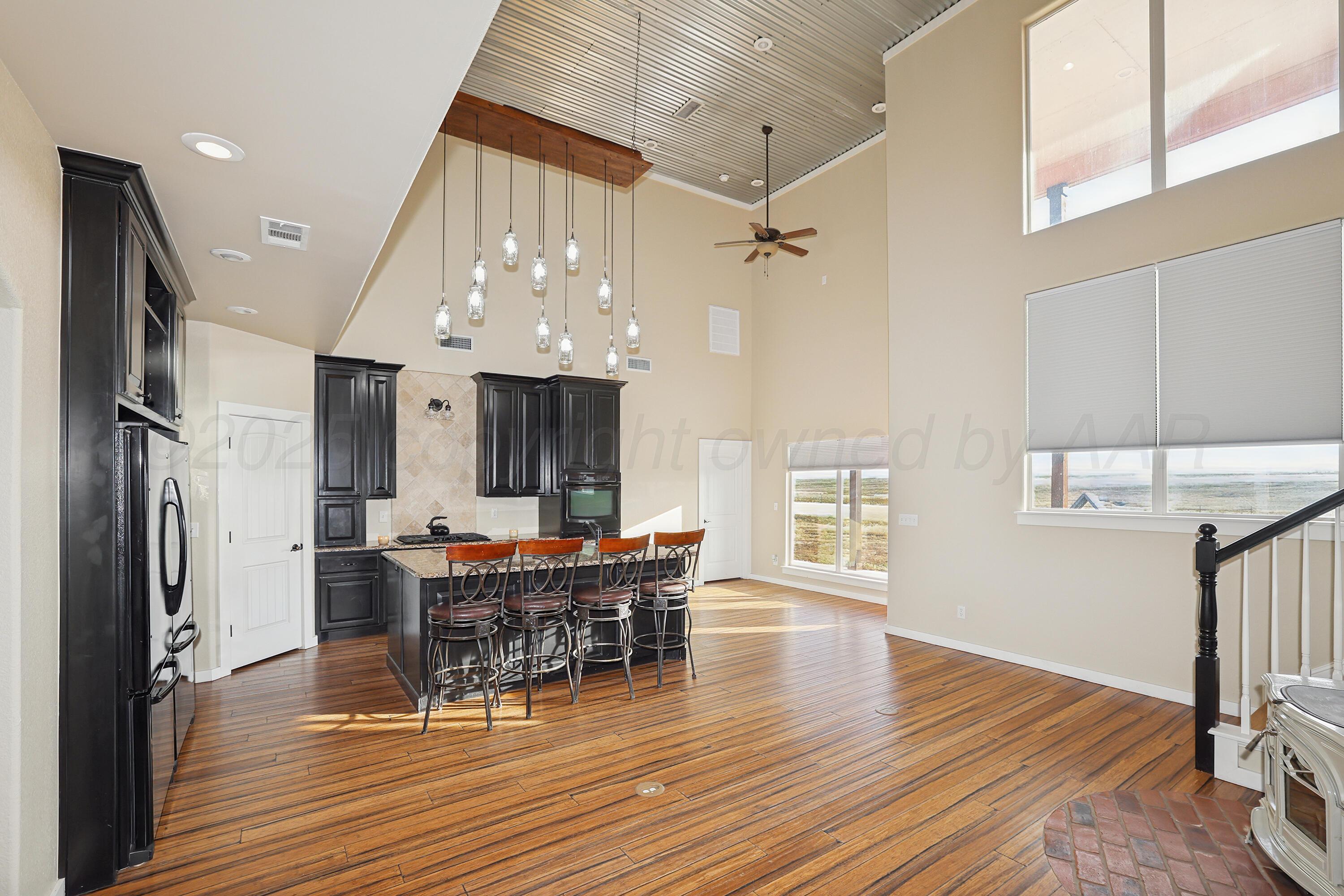 5282 County Road 8 Claude, TX 79019 - Photo 7 of 51 a view of a dining room with furniture window and wooden floor