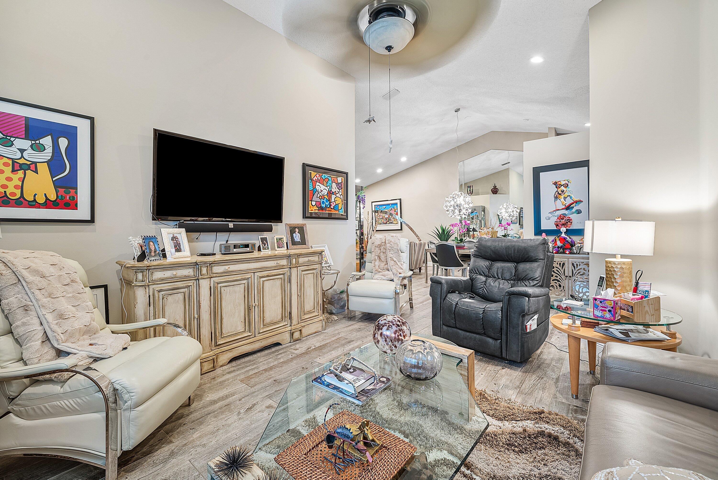 14338 Ruby Pointe Drive Delray Beach, FL 33446 - Photo 18 of 36 a living room with furniture and a flat screen tv