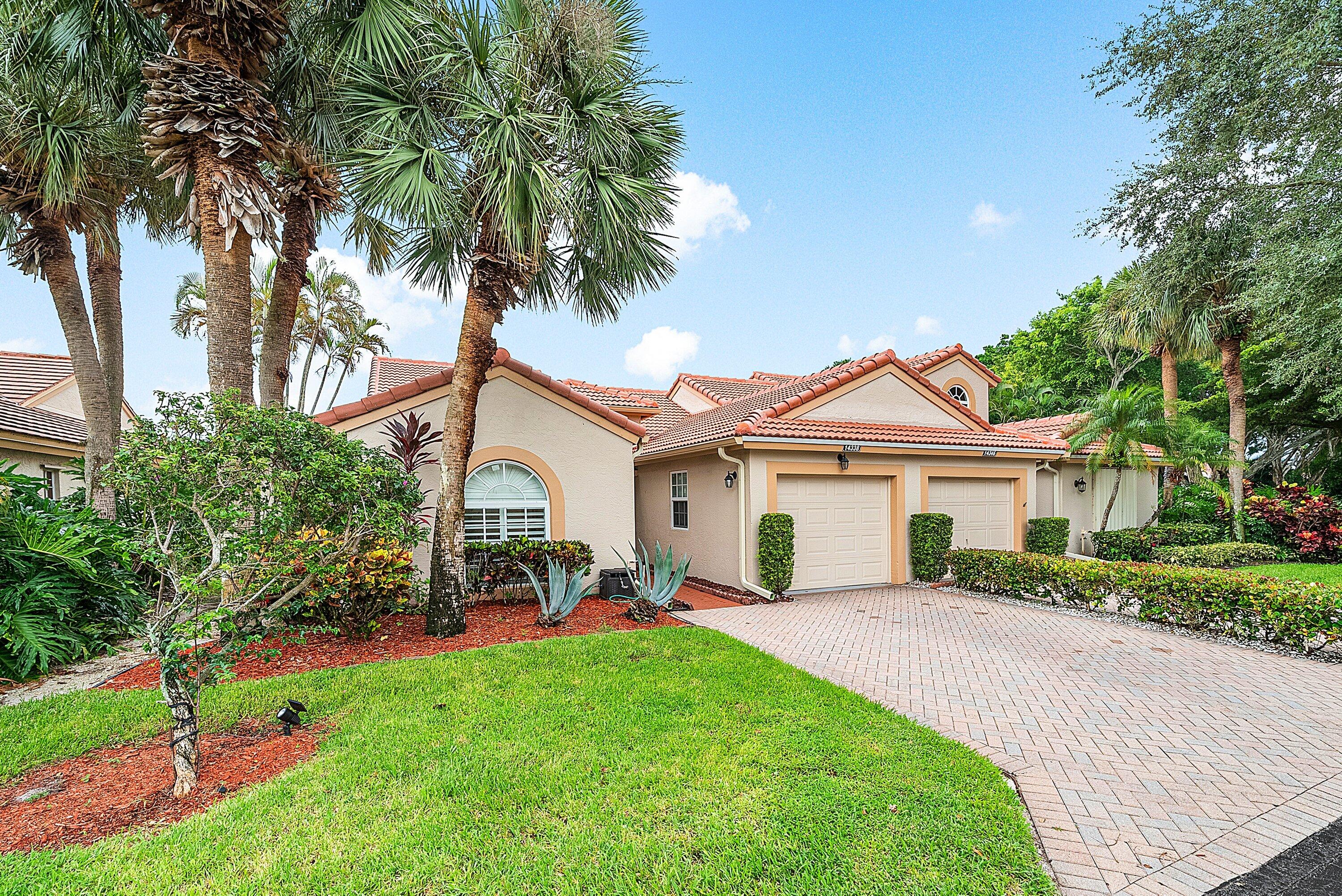 14338 Ruby Pointe Drive Delray Beach, FL 33446 - Photo 3 of 36 a view of a yard in front of a house