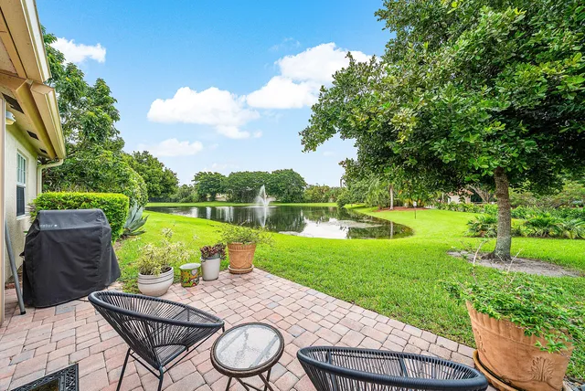 a view of a wooden deck and a garden