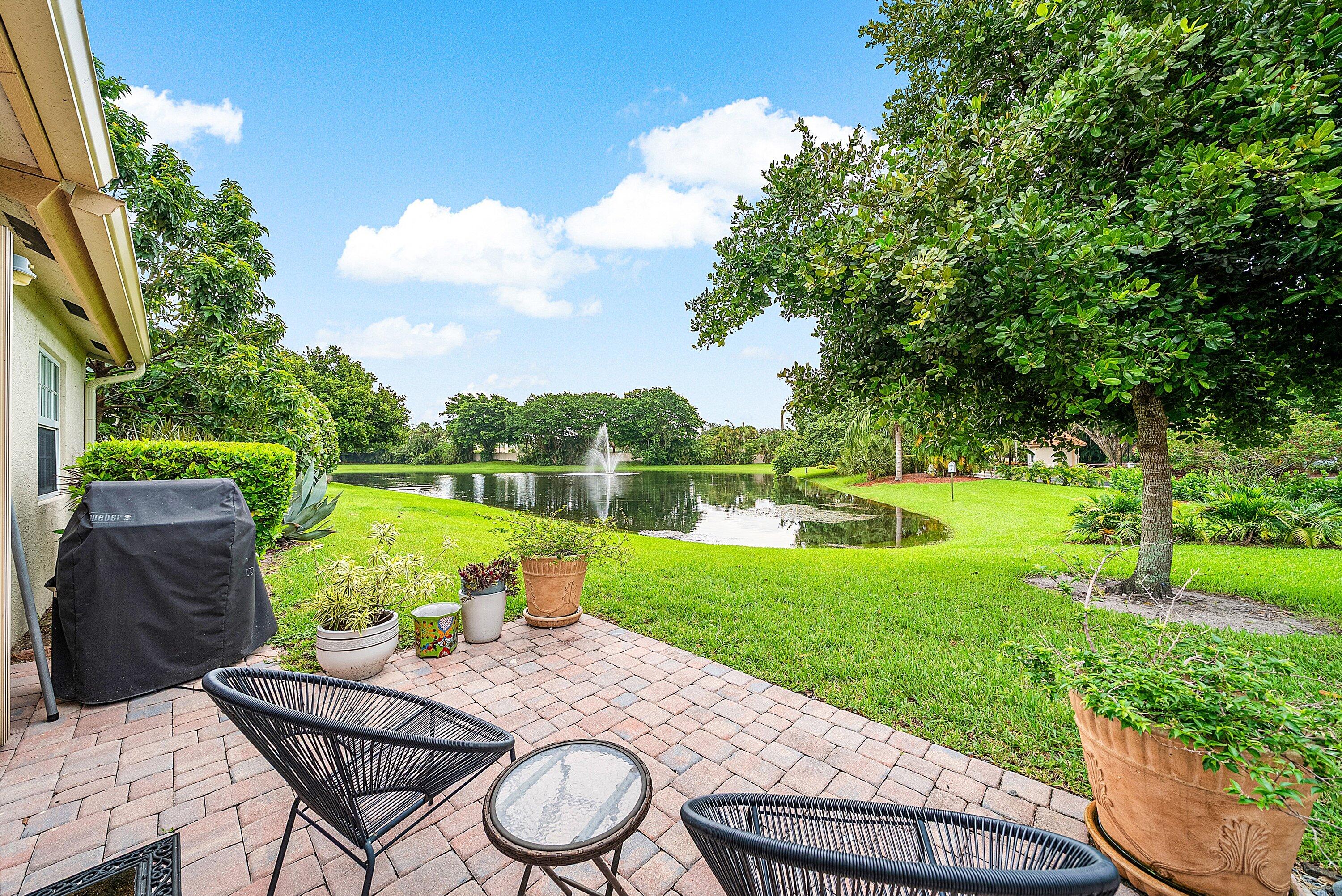 14338 Ruby Pointe Drive Delray Beach, FL 33446 - Photo 33 of 36 a view of a wooden deck and a garden