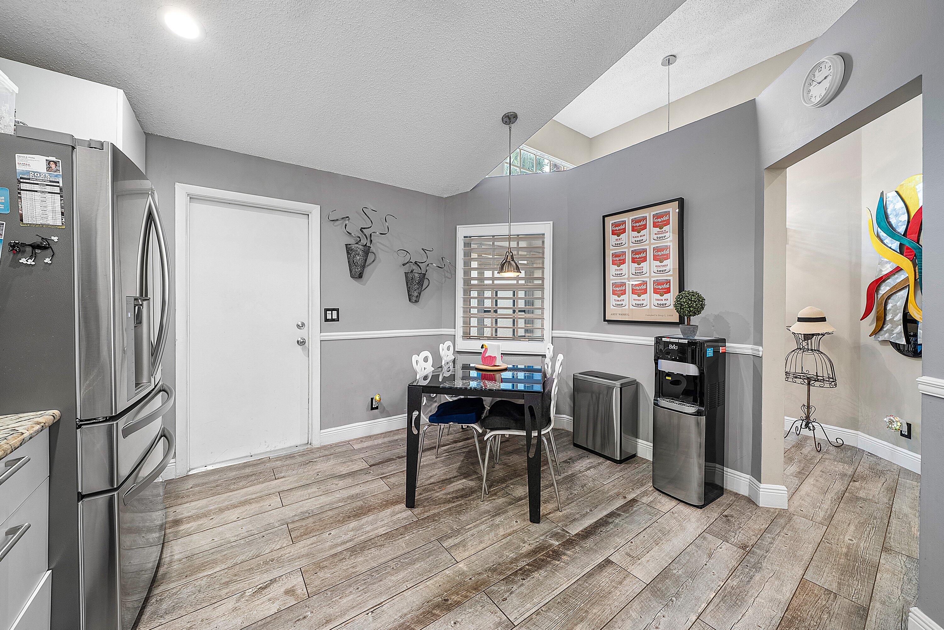 14338 Ruby Pointe Drive Delray Beach, FL 33446 - Photo 9 of 36 a work room with furniture and wooden floor