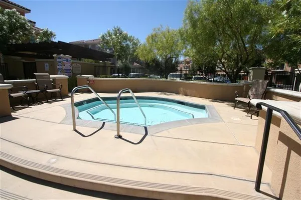 a view of a swimming pool with a patio
