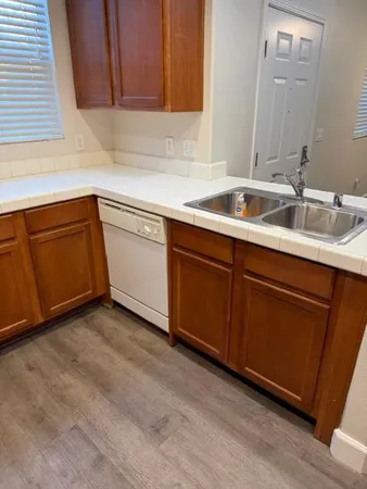 a kitchen with a sink and cabinets
