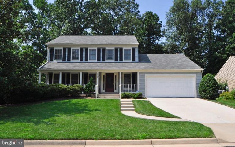 13157 Rounding Run Circle Herndon, VA 20171 - Photo 1 of 14 a front view of a house with a yard and porch