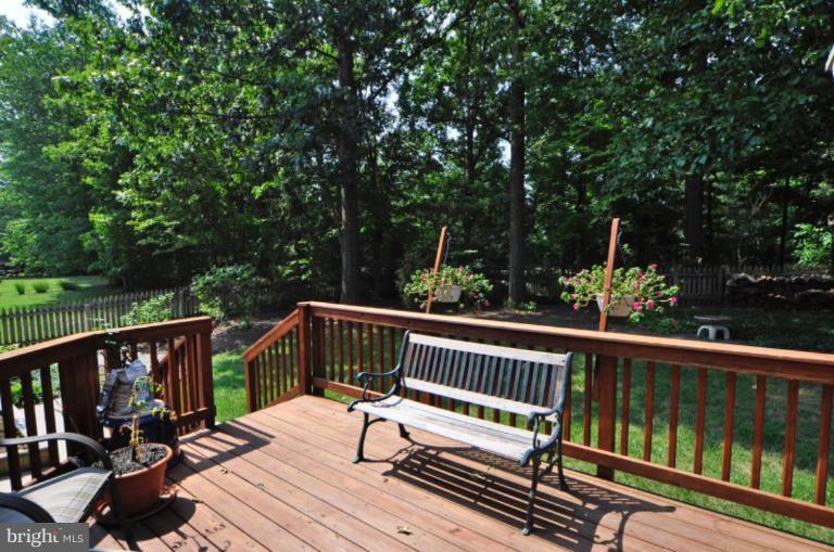 13157 Rounding Run Circle Herndon, VA 20171 - Photo 2 of 14 a view of balcony with wooden floor and outdoor seating