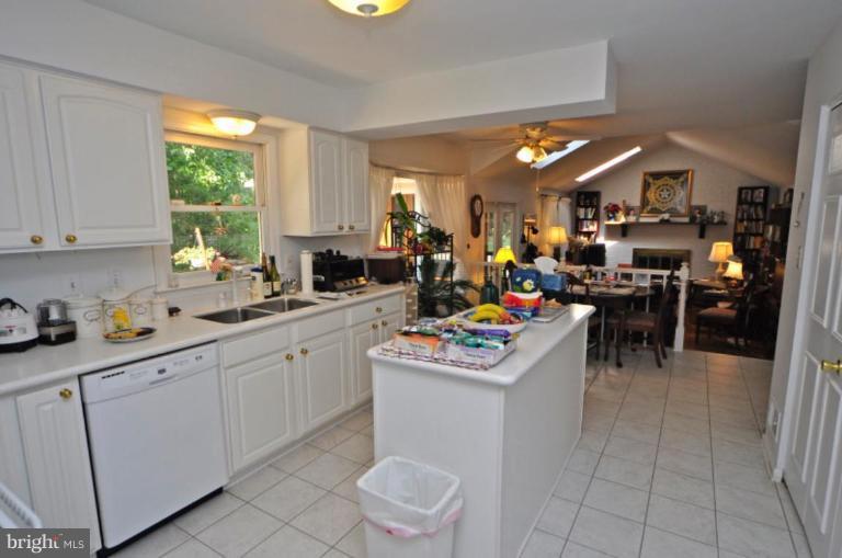 13157 Rounding Run Circle Herndon, VA 20171 - Photo 11 of 14 a view of a kitchen with kitchen island granite countertop lots of counter top space