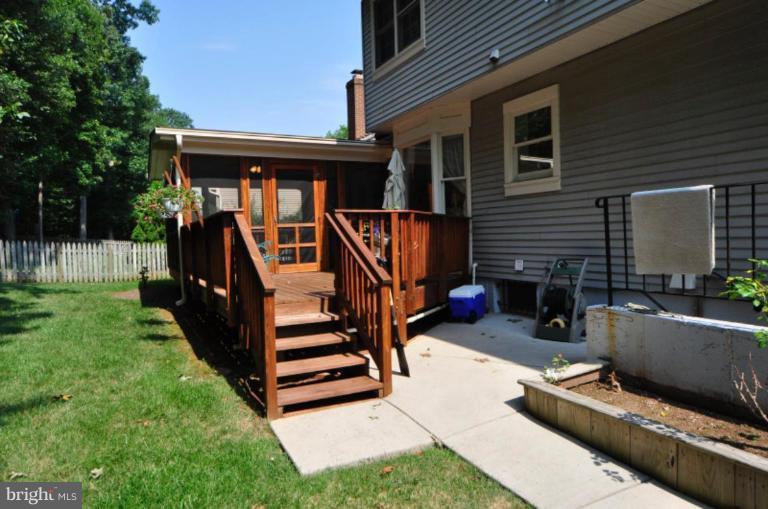13157 Rounding Run Circle Herndon, VA 20171 - Photo 3 of 14 a view of a house with backyard and sitting area