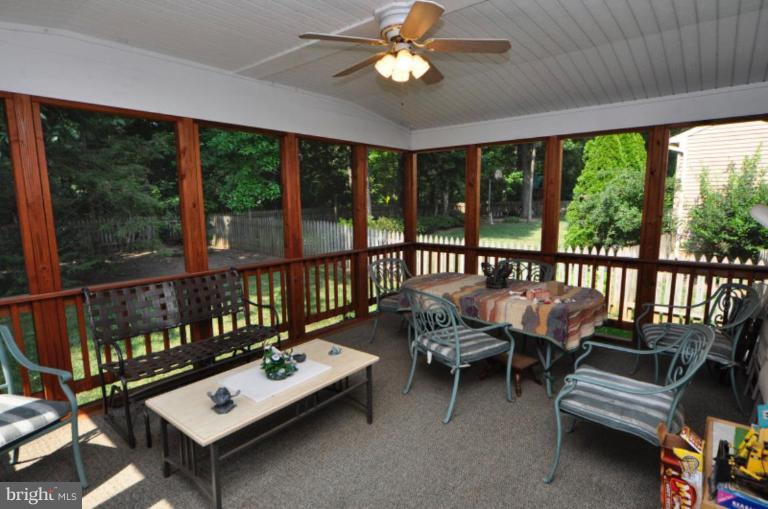 13157 Rounding Run Circle Herndon, VA 20171 - Photo 4 of 14 a living room with furniture and a floor to ceiling window