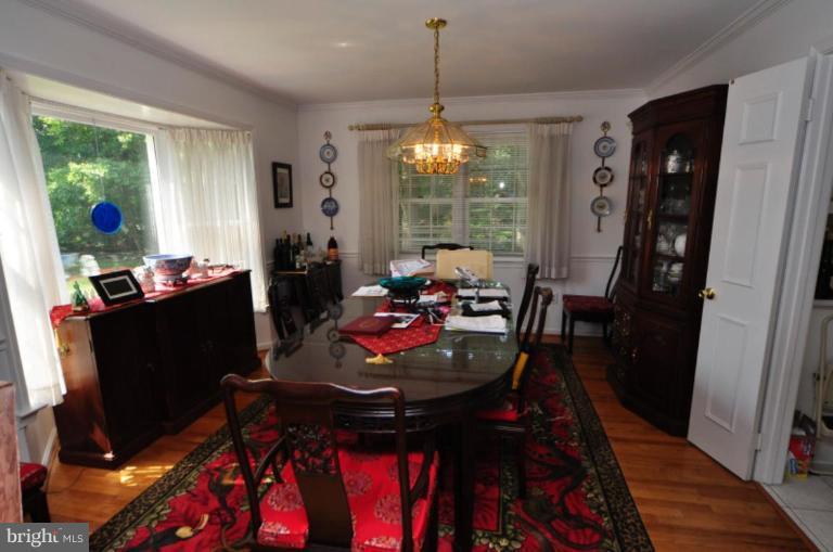 13157 Rounding Run Circle Herndon, VA 20171 - Photo 5 of 14 a view of a dining room with furniture window and outside view