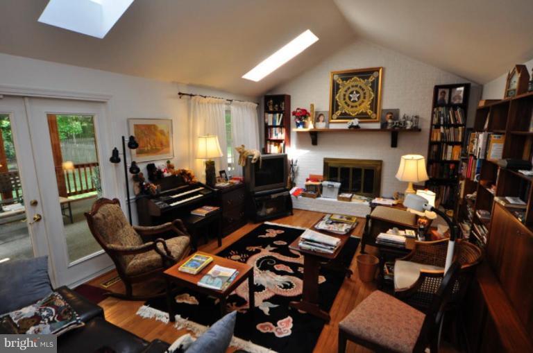 13157 Rounding Run Circle Herndon, VA 20171 - Photo 10 of 14 a living room with furniture and a fireplace