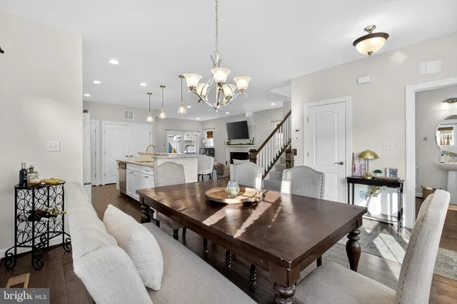 a living room with furniture a table and chairs