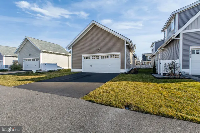 a view of a house with a window and wooden fence