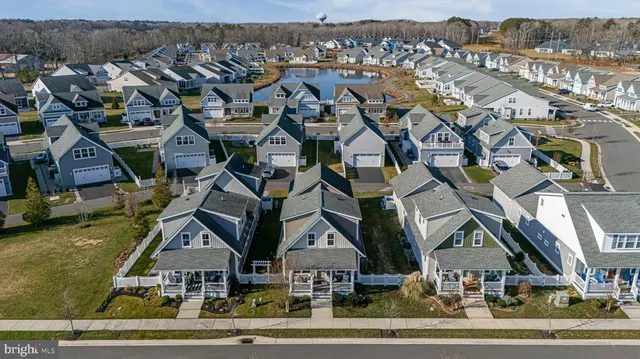 an aerial view of a house with a ocean view