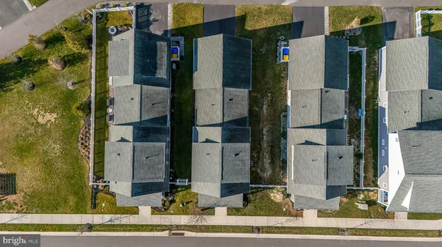 an aerial view of a house with roof deck