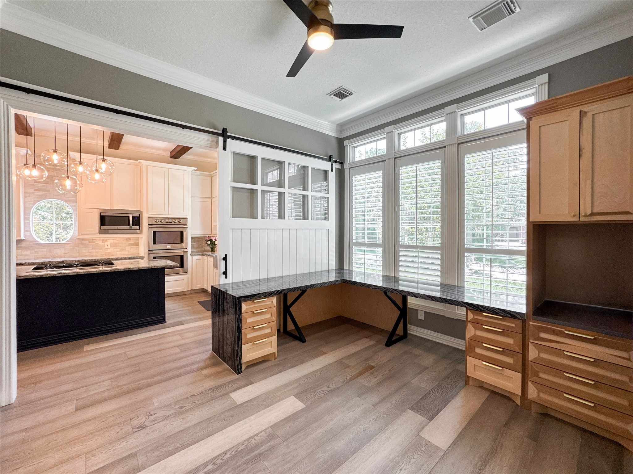 1810 Woerner Road Houston, TX 77090 - Photo 9 of 39 Bright and inviting space perfect for an entryway or home office, featuring large windows, stylish flooring, and ample built-in storage.