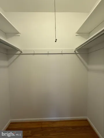 a view of an empty walk in closet