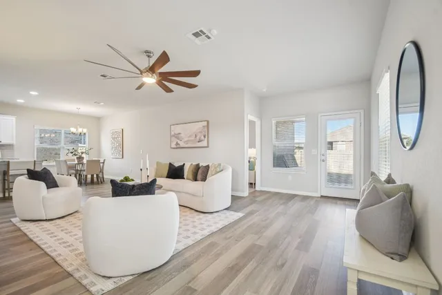 a living room with furniture and a large window