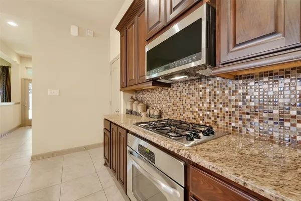 a living room with a fireplace and a flat screen tv