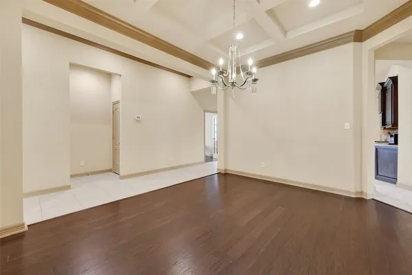 a kitchen with granite countertop a stove top oven microwave and cabinets
