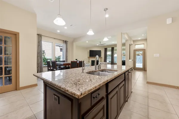 a living room with furniture fireplace and a large window