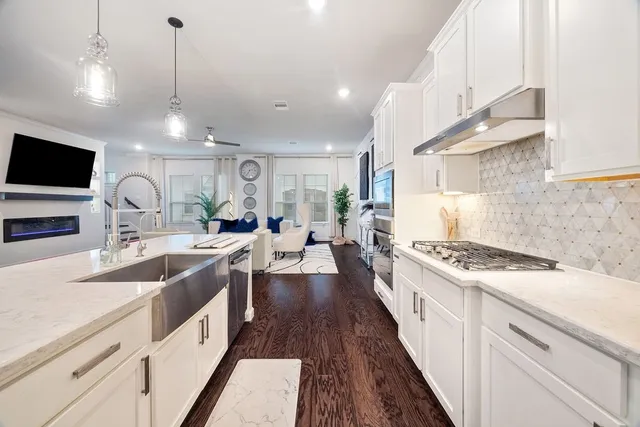 a spacious bedroom with a bed and a large window