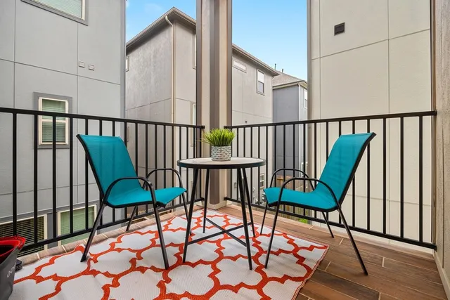 a spacious en suite bathroom with a double vanity sink and a mirror