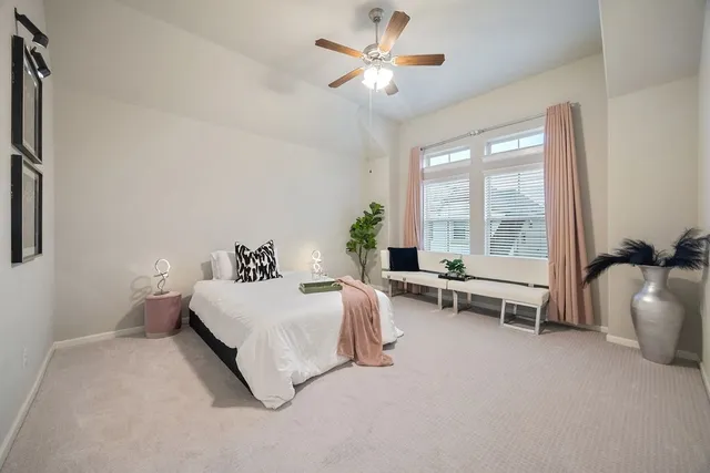a view of walk in closet with clothes
